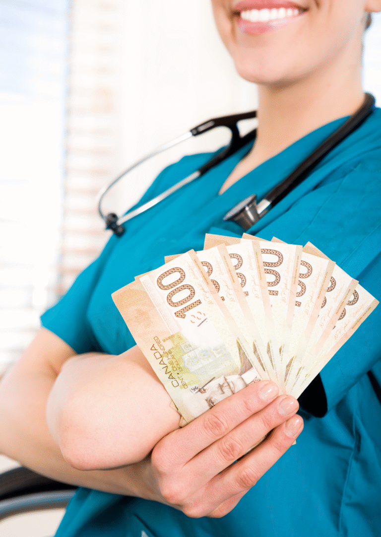 photo of a nurse in scrubs holding money